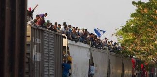 Migrants ride north aboard the freight train called The Beast.