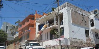 Rubble goes down the chute in the demolition stage of the renovation.