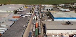 Trucks line up to cross the border at Otay Mesa in Tijuana.