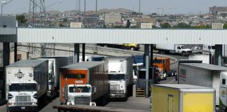 Trucks carry Mexican exports into the US at a Juárez-El Paso border crossing.