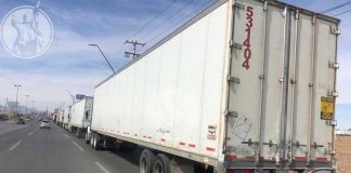 A long line of trucks waits to cross the border between Juárez and El Paso.