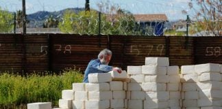Cavallaro at work on his border wall.
