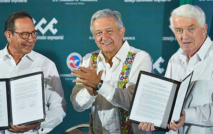 Business leaders Salazar, left, and Donohue, right, flank López Obrador.