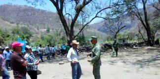 A farmer and a soldier parley in Guerrero.
