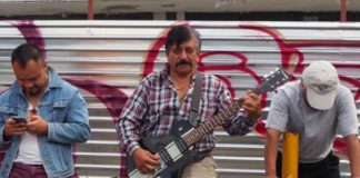 Everyone’s a rock star. Felipe Reyes poses with his guitar.
