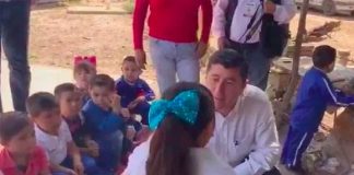 The mayor chats with the overweight student.