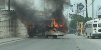 A burning bus forms a roadblock in Reynosa, where murders surged 225%.