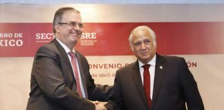 Ebrard, left, and Torruco shake on new training agreement.