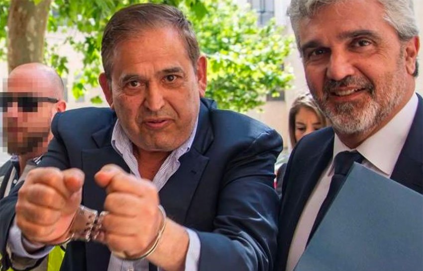 Altos Hornos CEO Ancira shows his handcuffs after his arrest this week in Spain.