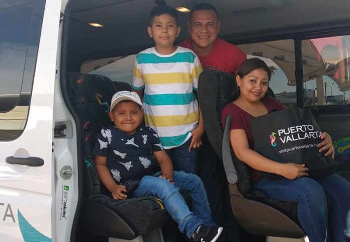 Andrick, left, and his family arrive in Puerto Vallarta on Friday.