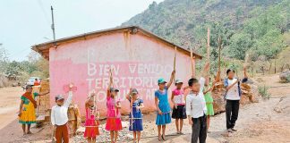 Children take up arms in the form of sticks in Guerrero mountain community.