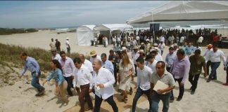 Governor Alfaro leads a tour of the beach during the announcement of a Costalegre development plan.
