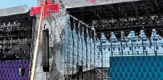 Workers erect the stage for the two-day festival Domination México.