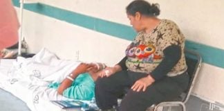 A patient waits for a bed in the hallway of a hospital in Irapuato, Guanajuato.
