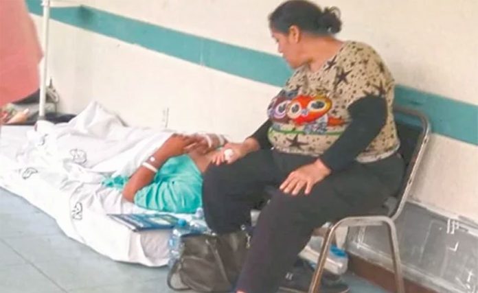 A patient waits for a bed in the hallway of a hospital in Irapuato, Guanajuato.