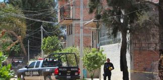 Police at the house in Tlajomulco where kidnapping victims were found.