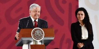 The president and Labor Secretary Alcalde celebrate new labor legislation.