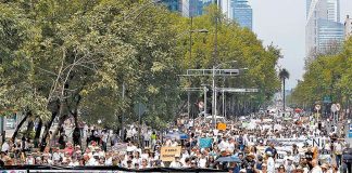 #AMLOresignation, reads the hashtag on the banner at the Mexico City march.