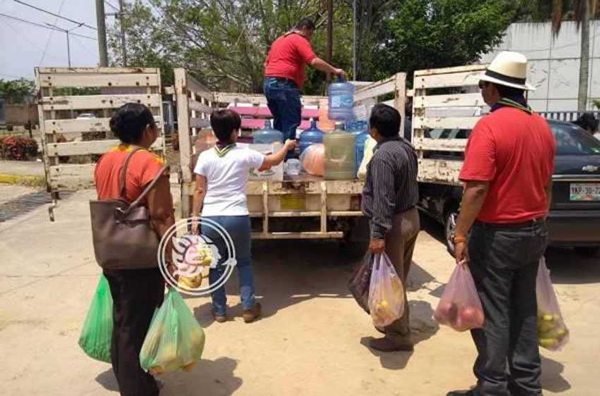 Residents of a nearby town gather fruit for the monkeys.