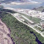 The site of the new refinery is the cleared land to the left.