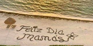 'Happy day, moms,' reads the message on a Cancún beach.