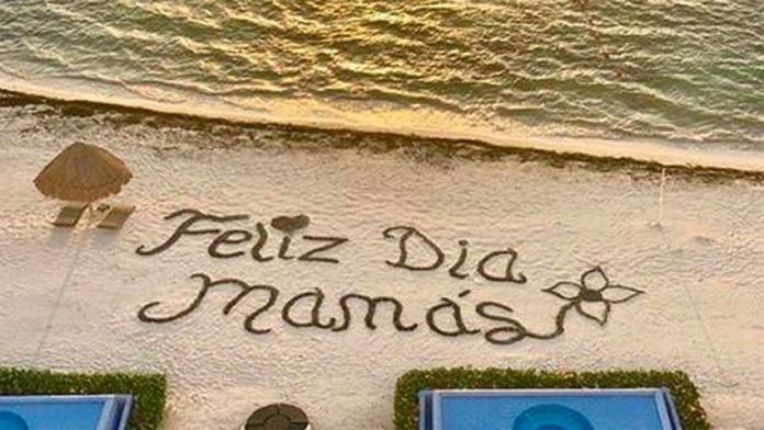 'Happy day, moms,' reads the message on a Cancún beach.