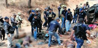 Security forces at the scene of crime gang shootout.