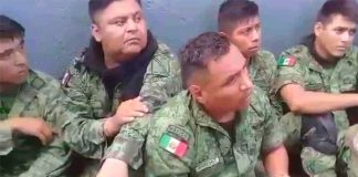 Some of the soldiers who were detained by civilians on Sunday in Michoacán.