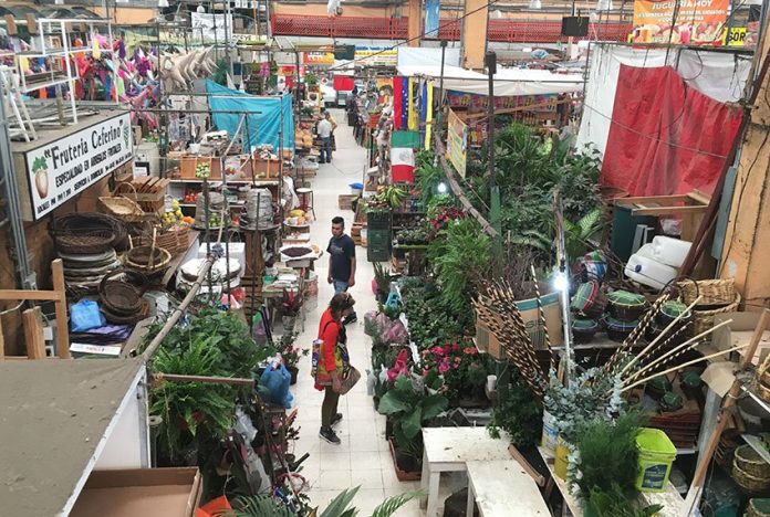 Walk across the 50-plus seating area at Cha-Cha-Cha for views from above into Mercado de Medellín.