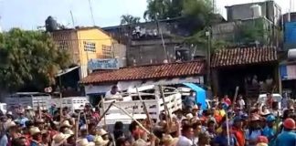 Armed with sticks, citizens attack municipal offices.