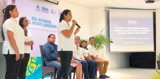 The three students present their air quality findings.