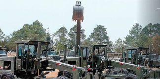 The military's heavy equipment is ready to build the airport, but the permits aren't approved yet.