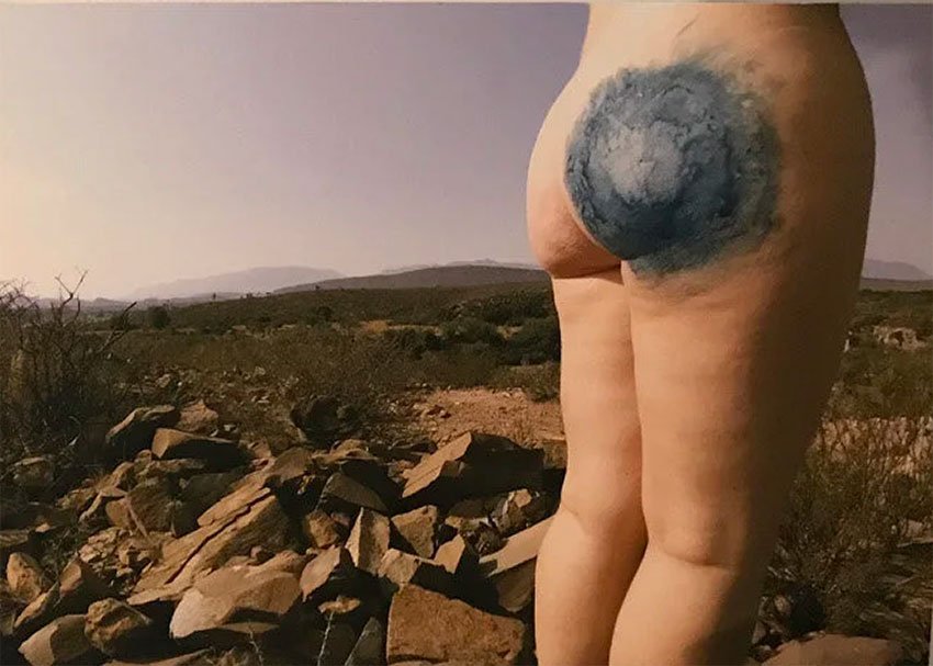 The imprinted petroglyph on the artist's derriere.