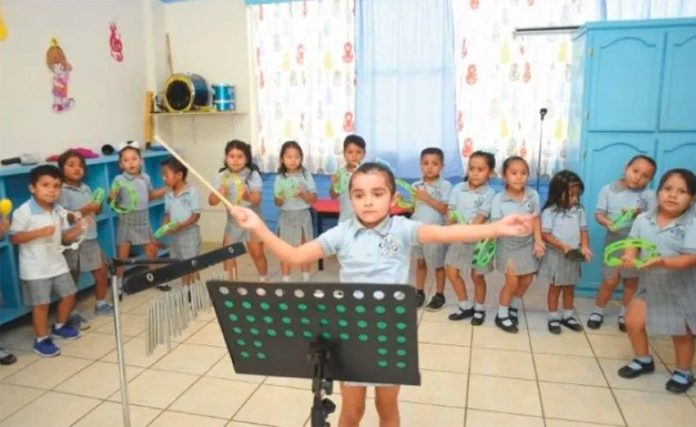 The high-energy young director of a children's orchestra in Tamaulipas.