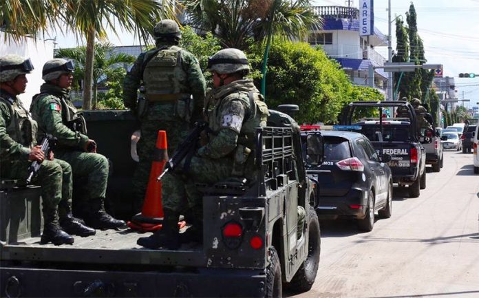 The first mobilization of the National Guard appears in Chiapas, though dressed in police and military uniforms.