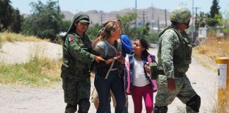 Soldiers detain migrants at northern border Friday but president says they have no orders to do so.