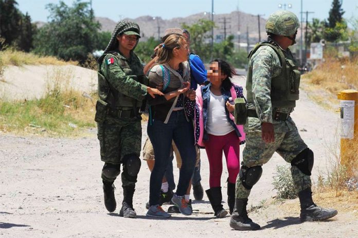 Soldiers detain migrants at northern border Friday but president says they have no orders to do so.