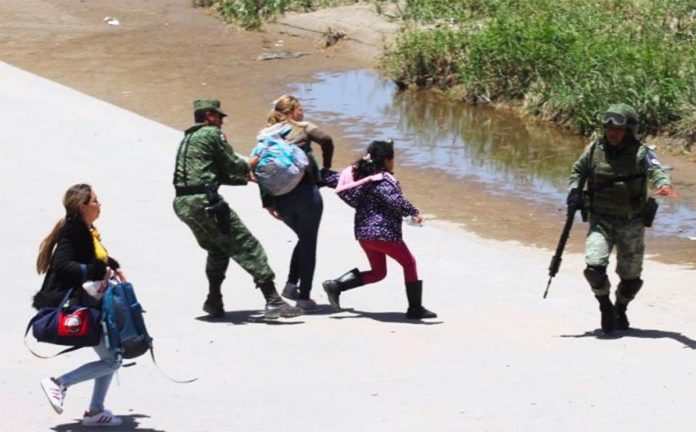 Soldiers nab migrants attempting to cross the northern border into the US.