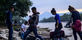 Migrants enter Mexico from Guatemala.