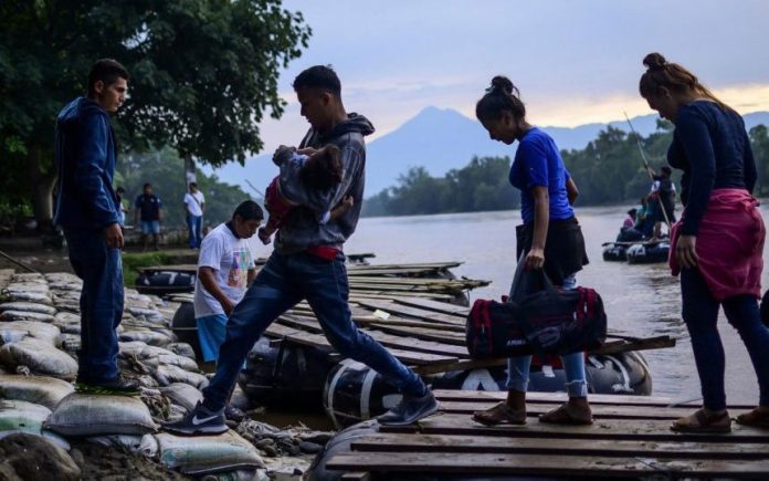 Migrants enter Mexico from Guatemala.