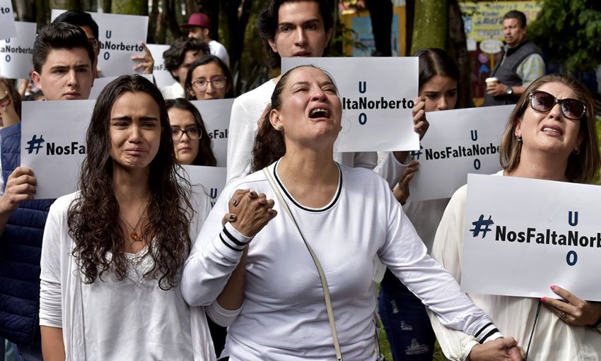 A mother's grief: Norelia Hernández is overcome during a march to demand justice for her kidnapped son.