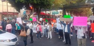 Supporters of the priest arrested in murder case protest Thursday in Mexico City.