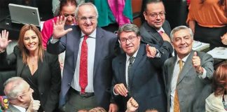 Senators and Jesús Seade, second from left, celebrate trade deal's approval.