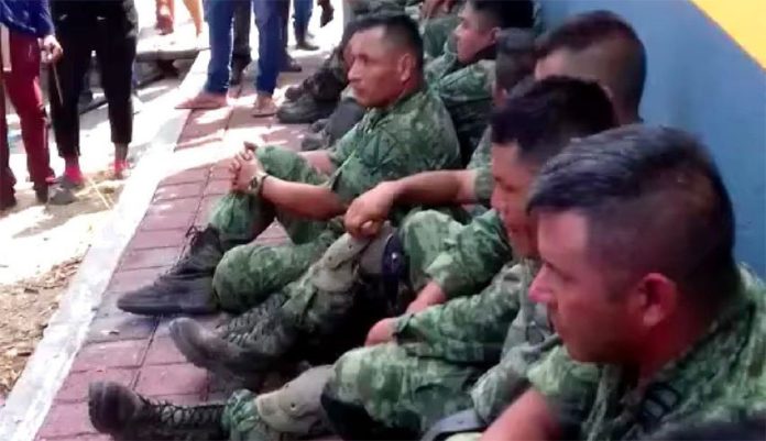 Soldiers who were taken captive by suspected cartel operators.