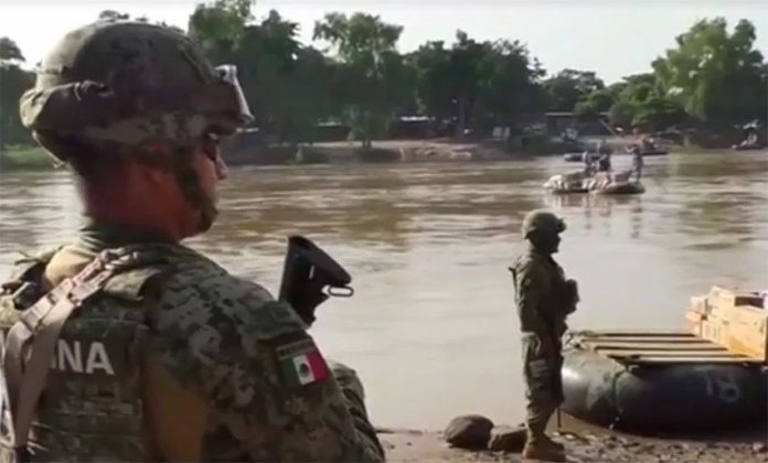 Marines on patrol at the Suchiate river.