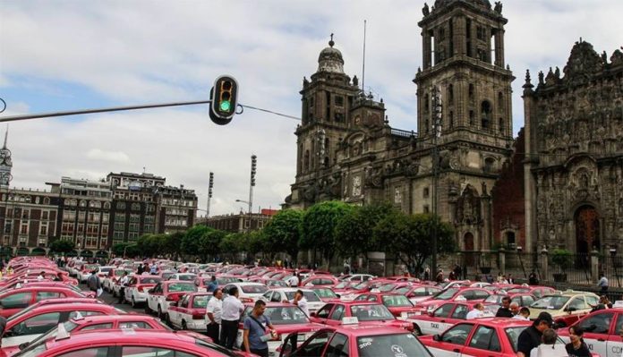 A cluster of taxis in Mexico City on Monday.