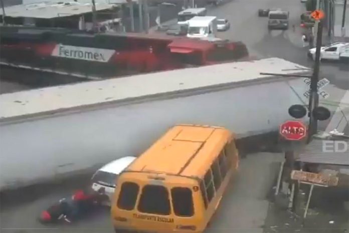 Frame from security video shows the train pushing the trailer out of its path.