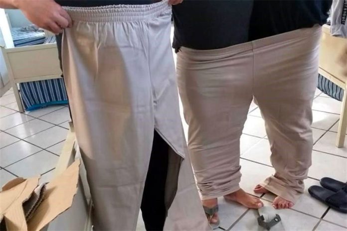 Two people can fit snugly into one pair of officers' new pants.