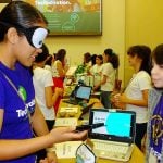 A blindfolded visitor gives Be My Eyes a practical test. The app was developed to help the blind get around.