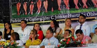 A photo of the class behind the head table announces sponsorship by wanted gang leader.